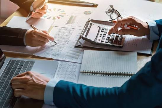 Financial experts analyzing data together